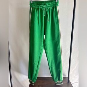 Green striped track pants